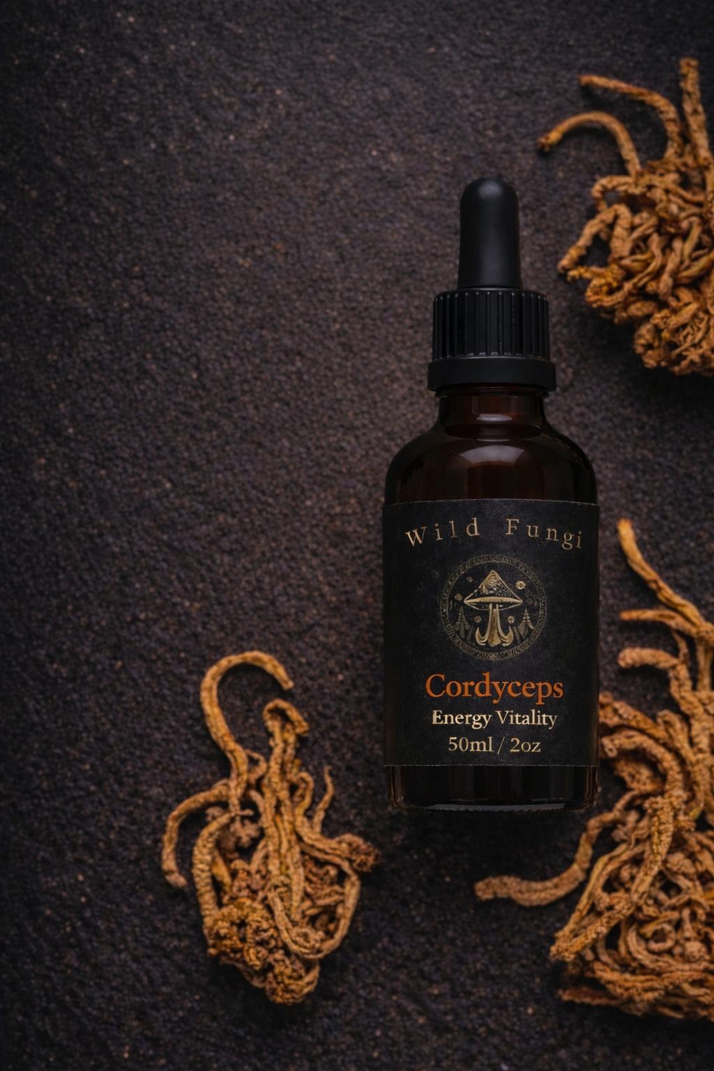 Bottle of Wild Fungi Cordyceps supplement on a dark background with dried cordyceps plants.